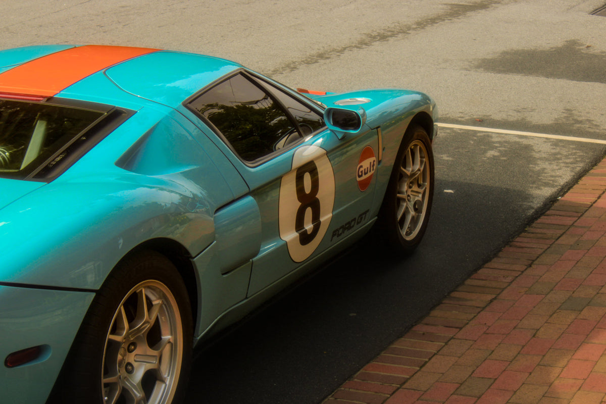 High-angle view of turquoise and orange number 8 Ford GT, photographed by Jordan Lombard