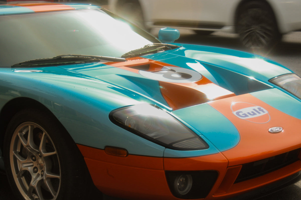 Turquoise and orange Gulf-liveried Ford GT in bright sunlight, photographed by Jordan Lombard